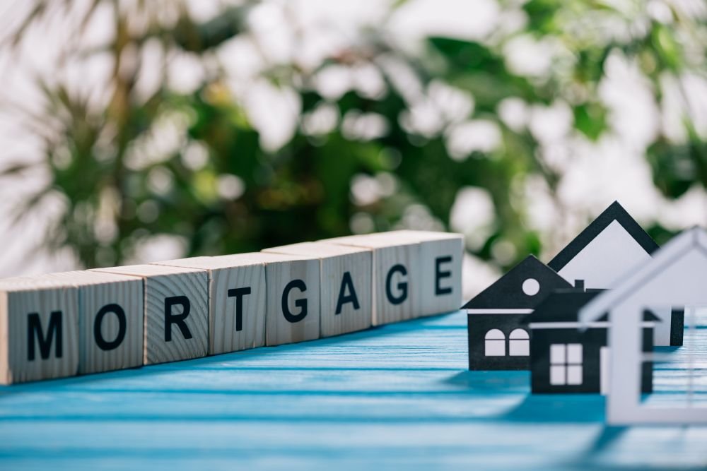 Second mortgage concept showing a model house and mortgage blocks, illustrating home equity and alternative financing options
