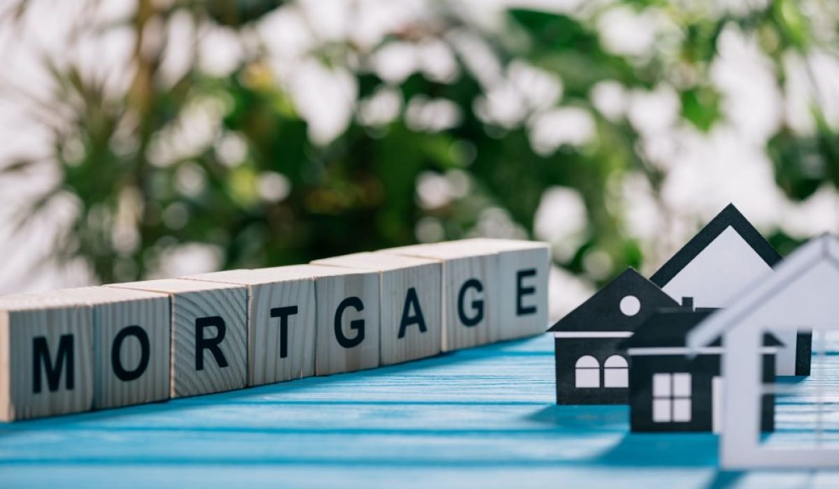Second mortgage concept showing a model house and mortgage blocks, illustrating home equity and alternative financing options