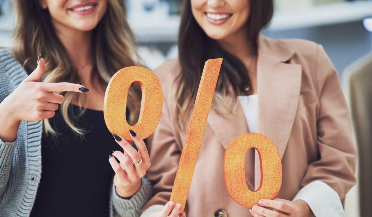Two women holding a percentage sign, symbolizing Ontario mortgage rates August 2025. Contact Maurice at 416-618-9312 or maurice@mortgagemaurice.ca for guidance